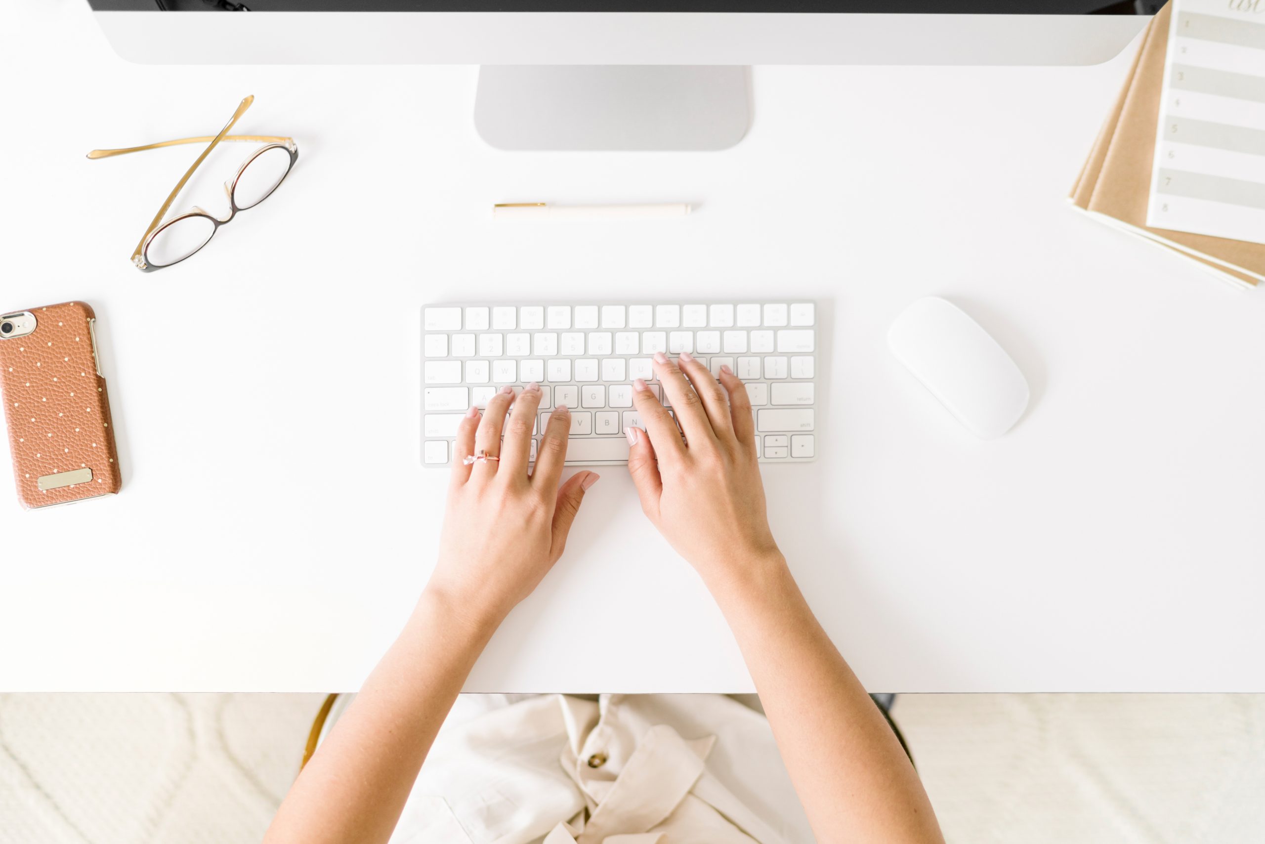 Typing on a white keyboard